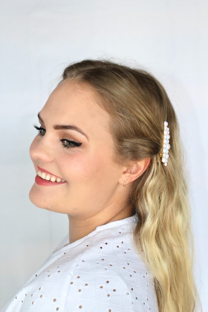 Girl wearing pearl hair clip